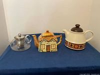 Front view of all three teapots