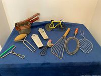 Group shot of all utensils on blue surface