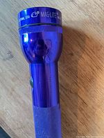 Close-up of Mag-Lite head showing branding and blue finish