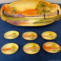 top view of platter and six dishes showing design