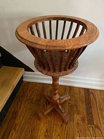 Full view of oak plant stand showing pedestal and base