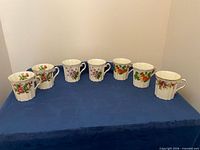 Front view of seven floral bone china teacups