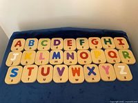 Alphabet letter tiles arranged A–Z