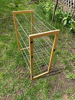 Angled view showing wood sides and wire shelves