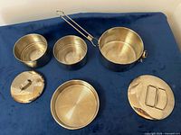 Set arranged showing three containers and three lids