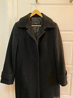 Front view of black Talbots coat hanging
