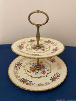 Front view of assembled two-tier porcelain stand
