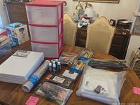 Lot overview: storage drawers, canvases, brushes, paints, easel
