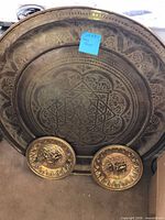 Front view of large tray with two smaller plates below