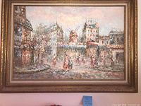 Full view of framed cityscape painting