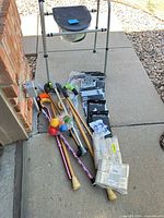 Overall lot showing commode, canes, packaged braces and accessories