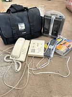 Group shot showing all items including bag, telephone, dialer, speakers, remotes, cable and cords