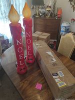 Tree box and two Noel candles on dining table