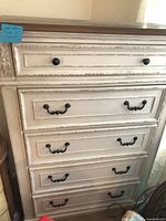 Full front view showing six drawers and hardware