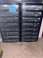 Front view of two black plastic desktop organizers showing twenty clear drawers