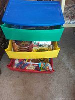 Front view of multicolor Sterilite drawer unit with open drawers showing contents