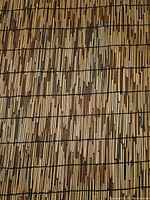 Close view of bamboo reed fence texture and twine binding
