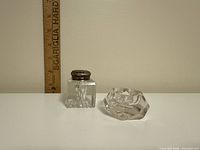 Both inkwells side by side, ruler for scale