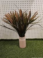 Full view of artificial arrangement in pink mason jar