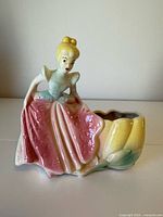 front view showing Cinderella figure and planter opening