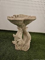 Full view of cement bird bath showing pedestal and basin