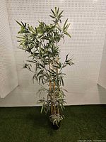 Full view of the artificial bamboo plant in pot
