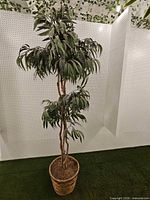 Full view of artificial tree in planter