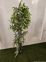 Full view of entire artificial bamboo plant in pot