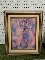 Front view of framed mixed-media painting