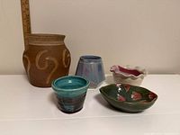 Group shot of all five ceramic pieces on white surface