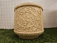 Full exterior view of planter showing floral relief and overall condition