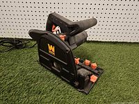 Left side view of WEN CT1065 track saw showing handle, guard and knobs