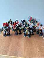 Group shot of all ten Rescue Heroes figures standing on table