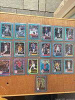 All 19 blue holographic Panini Hoops cards laid out in top loaders