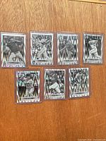 Front view of all seven sleeved RayWave cards