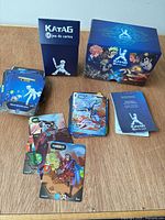 Full set displayed: card stacks, rule booklet, inner and outer boxes visible