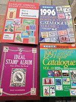 All four books and album front covers visible