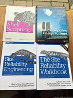 All four books laid out showing front covers