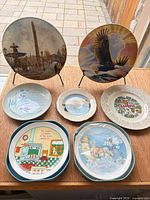 All seven plates displayed front view on table