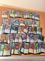 Spread of assorted Unfinity foil cards, various colors and rarities