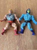 Front view of He-Man and Skeletor figures standing