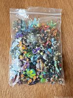 Sealed clear bag containing large assortment of miniature figures