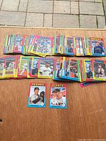 Overview of large spread of Topps 2024 baseball cards on table