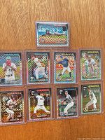 All nine Topps Chrome checkerboard refractor cards in sleeves