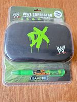 Front view of sealed blister pack showing carry case with DX logo and stylus pen