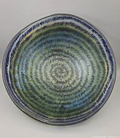 Top view showing interior green-blue spiral design and bubbles