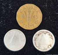 Group view of 1940 and 1941 dimes with reverse ship design and 1943 Victory nickel