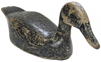Left front view of entire decoy showing carved shape, paint wear