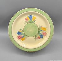 Front of plate showing floral design and green border