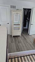 Armoire at room view showing proportion and style
